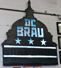DC Brau sign with neon backing