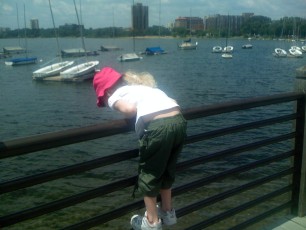 Mykala looking at a duck at the Lake Calhoun Pavillion