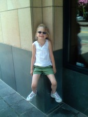 Mykala sitting on a ledge