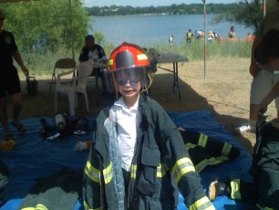 Mykala wearing fire fighter clothes