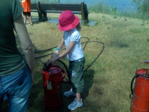 Mykala using a fire extinguisher