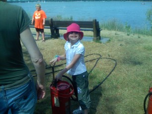 Mykala using a fire extinguisher