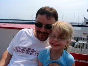 Mykala and Daddy sitting on the Madeline Island Ferry