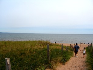 Mykala and Daddy walking towards the beach