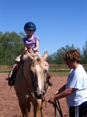 Mykala riding a horse