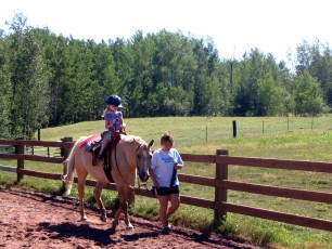 Mykala riding a horse