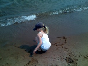 Mykala playing in the sand at Park Point