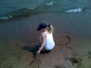 Mykala playing in the sand at Park Point