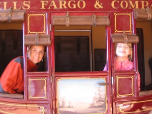 Mykala and Emily in a stage coach