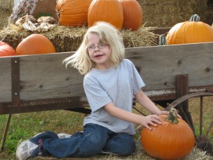 Mykala with some pumpkins at Sever's Corn Maze