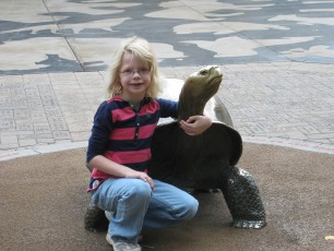 Mykala posing with a turtle at Como Zoo