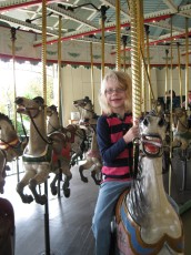 Mykala on the carousel at Como Zoo