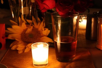 Sunflower, candle and beer