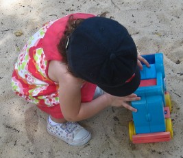 Bailey playing with a truck