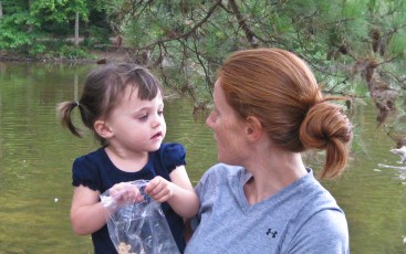 Emily and Bailey feeding the ducks.