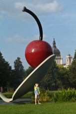 Mykala posing in front of the Cherry and Spoon at the Walker Sculpture Garden