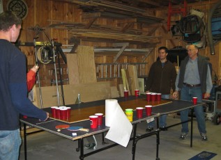 Fernando and Bob playing beer pong