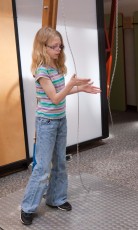 Mykala playing with a chain at the Minnesota Science Museum