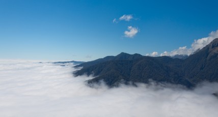 ilford Sound covered with clouds where it joins the Tasman sea (as seen from the plane)